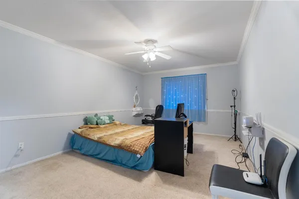 a bed room with a bed and a chair