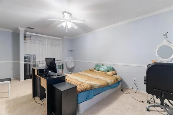 a bedroom with a bed and furniture