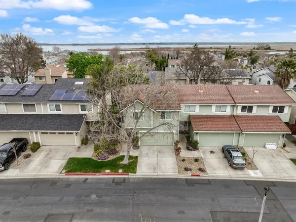 an aerial view of residential houses with outdoor space