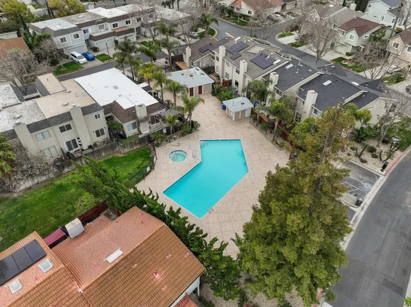 a view of a swimming pool with an outdoor space and seating area
