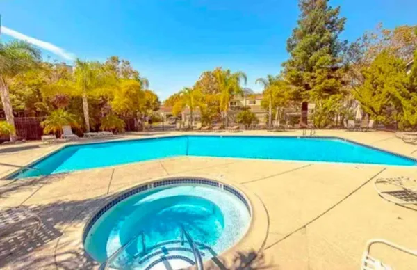 a view of yard with swimming pool