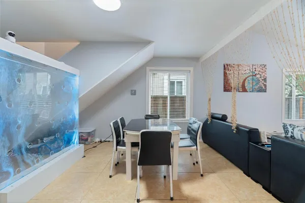 a view of a dining room with furniture window and outside view