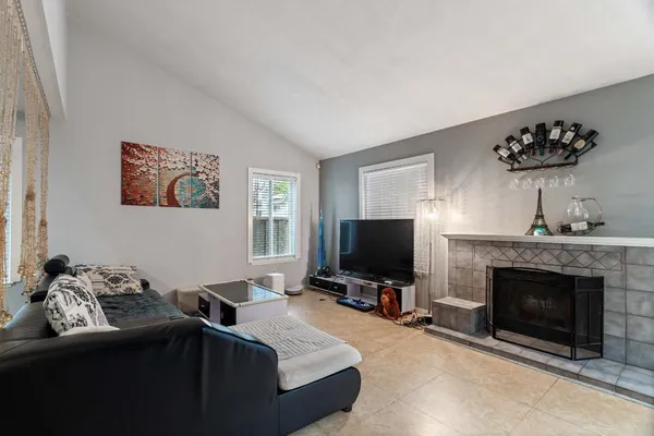 a bedroom with furniture and a fireplace
