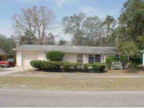 14370 Southwest 43rd Court Road Ocala, FL 34473 - Photo 1 of 1 front view of a house with a yard