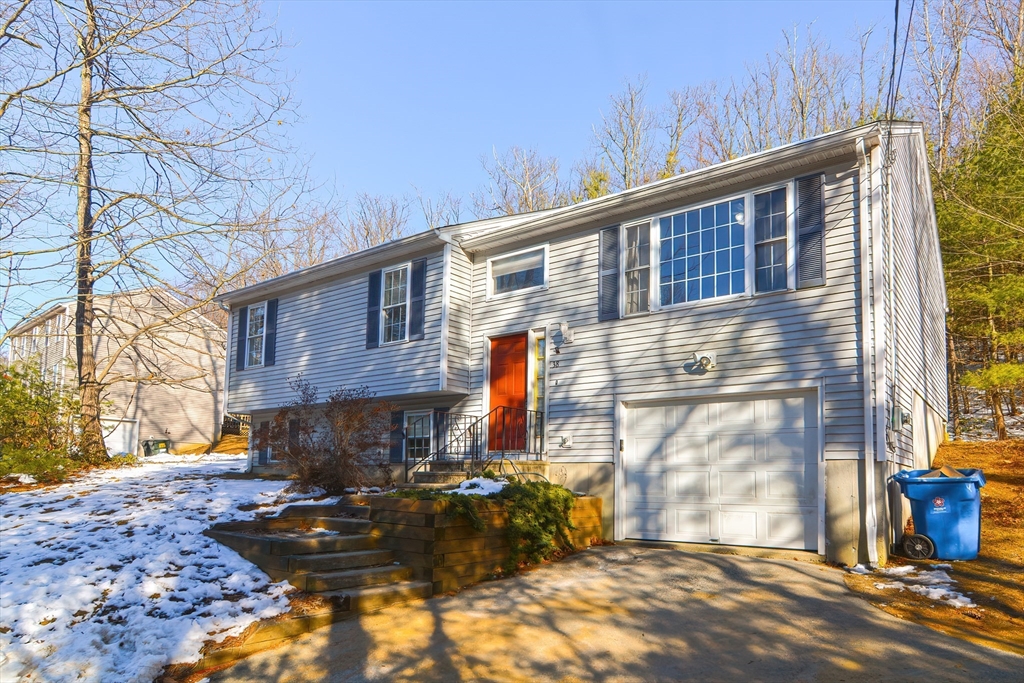 38 Clark Road Sturbridge, MA 01518 - Photo 1 of 30 a backyard of a house with seating space