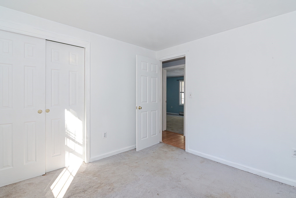 38 Clark Road Sturbridge, MA 01518 - Photo 18 of 30 a view of an empty room and a window