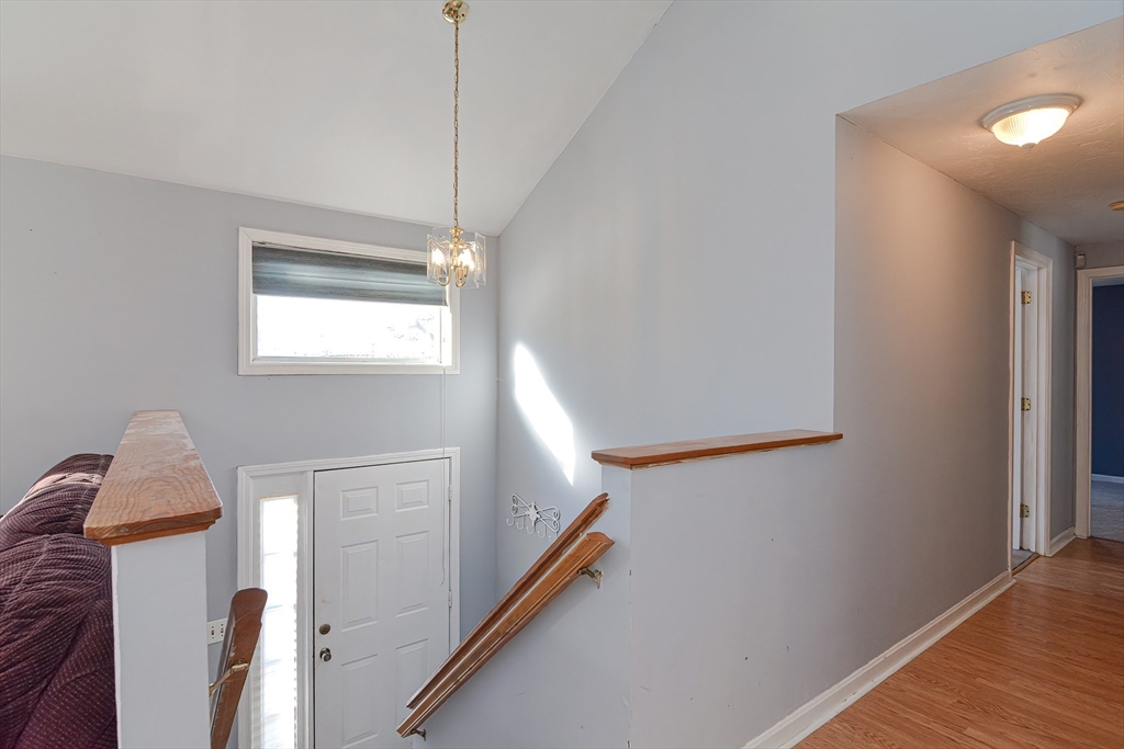 38 Clark Road Sturbridge, MA 01518 - Photo 4 of 30 a view of entryway and hall with wooden floor