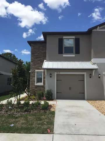 a house view with a backyard space