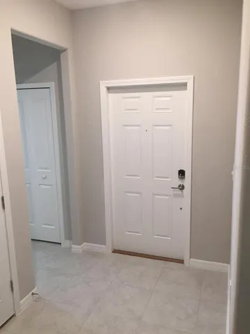 an empty room with closet area
