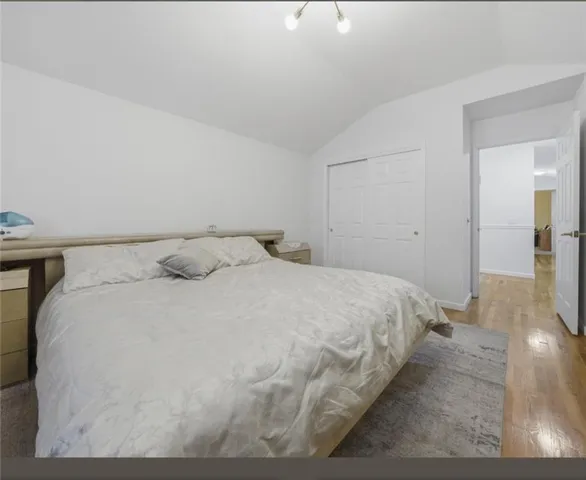 a bedroom with a bed and a view of bathroom