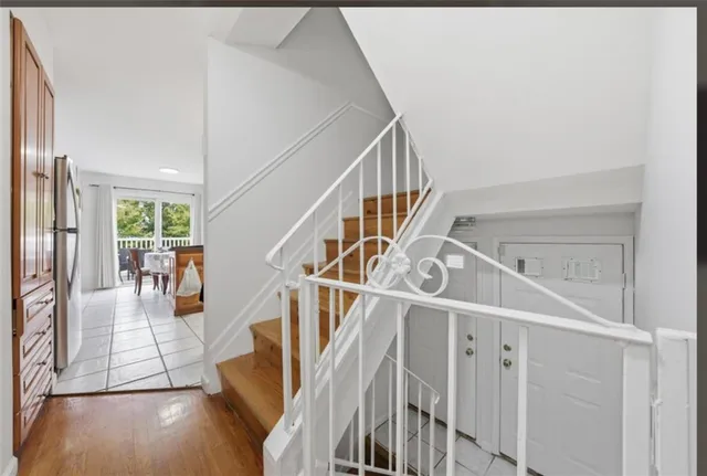 a view of entryway and hall with wooden floor