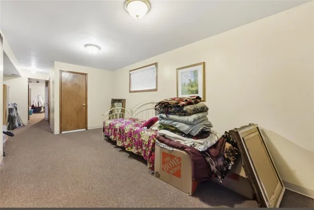 a bedroom with furniture and a window