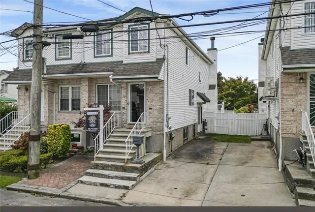 a view of a house with entryway doors