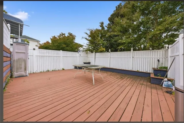 a backyard of a house with wooden floor