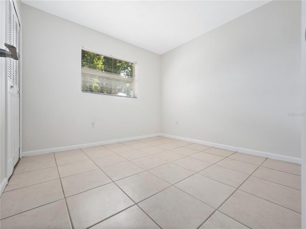 5400 Fox Briar Trail Orlando, FL 32808 - Photo 18 of 31 an empty room with a window