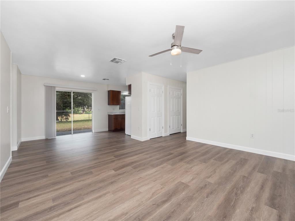 5400 Fox Briar Trail Orlando, FL 32808 - Photo 20 of 31 wooden floor in an empty room with a window