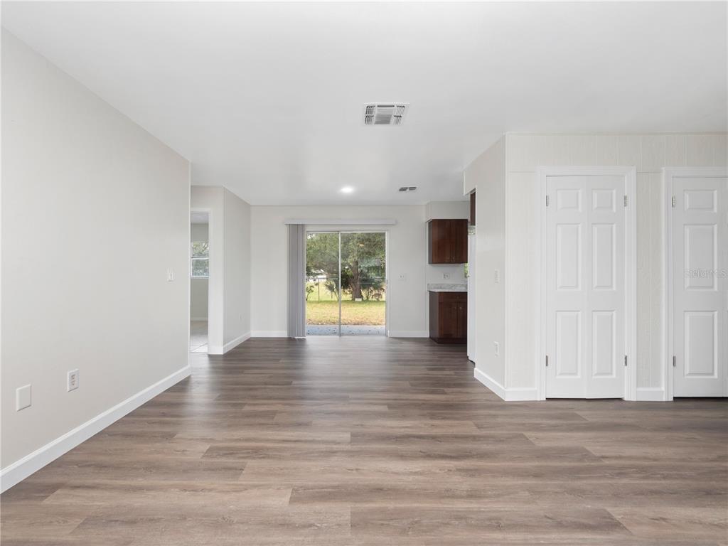 5400 Fox Briar Trail Orlando, FL 32808 - Photo 22 of 31 a view of an empty room with wooden floor and a window