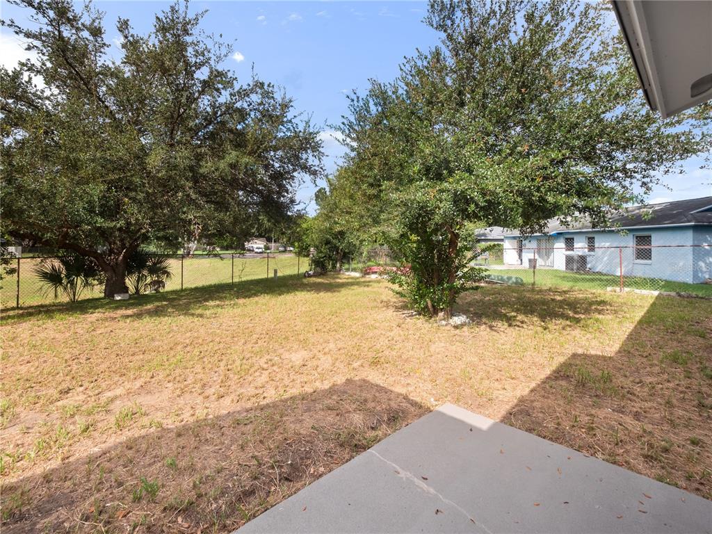 5400 Fox Briar Trail Orlando, FL 32808 - Photo 26 of 31 a view of yard with swimming pool