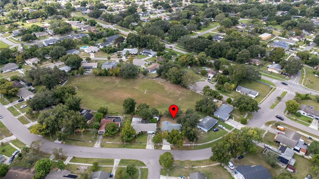 5400 Fox Briar Trail Orlando, FL 32808 - Photo 27 of 31 an aerial view of residential houses with outdoor space and trees