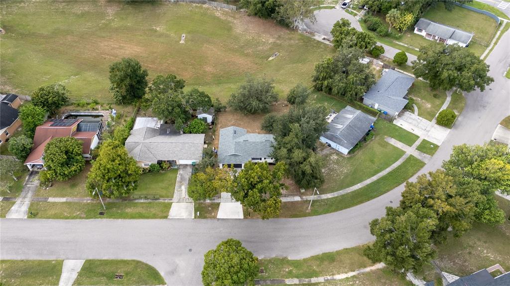 5400 Fox Briar Trail Orlando, FL 32808 - Photo 28 of 31 an aerial view of a house with yard swimming pool and outdoor seating