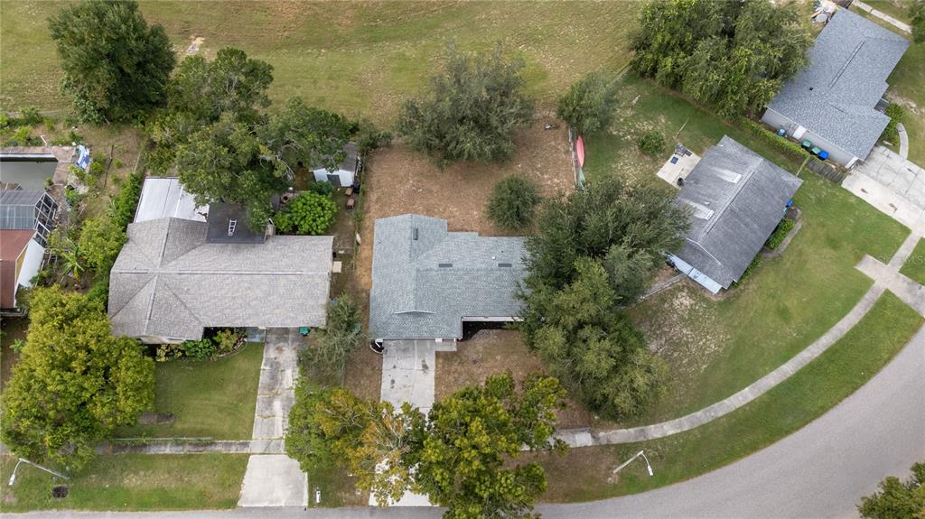 5400 Fox Briar Trail Orlando, FL 32808 - Photo 29 of 31 an aerial view of house with yard swimming pool and outdoor seating