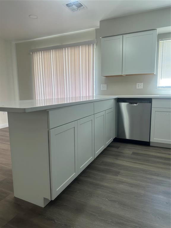 5400 Fox Briar Trail Orlando, FL 32808 - Photo 9 of 31 a kitchen with wooden cabinets and a sink