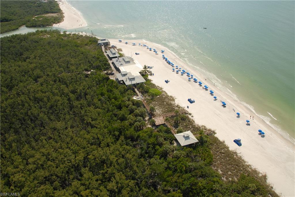 6573 Marissa Loop, Unit 1002 Naples, FL 34108 - Photo 17 of 24 an aerial view of a house a yard and mountain view in back