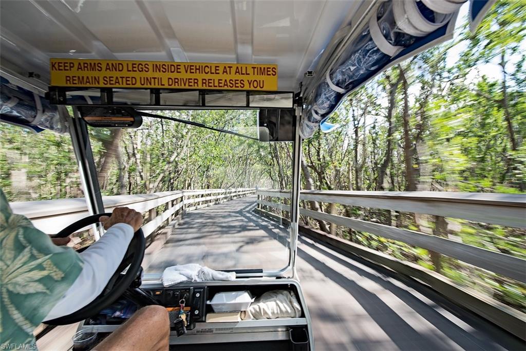 6573 Marissa Loop, Unit 1002 Naples, FL 34108 - Photo 21 of 24 a view of a two chair in the balcony