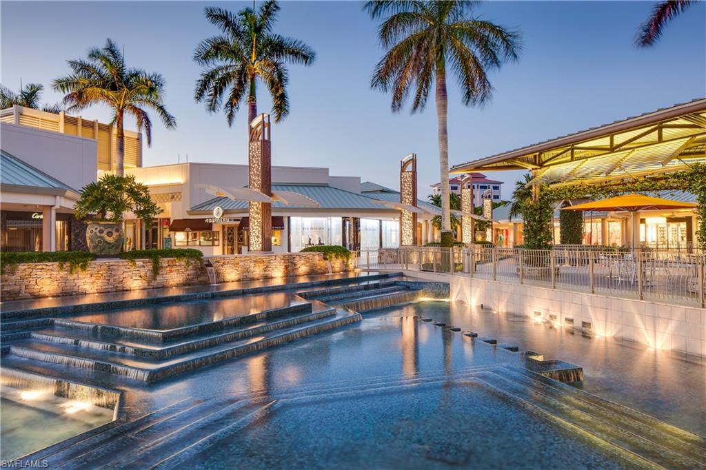 6573 Marissa Loop, Unit 1002 Naples, FL 34108 - Photo 22 of 24 a view of swimming pool with outdoor seating