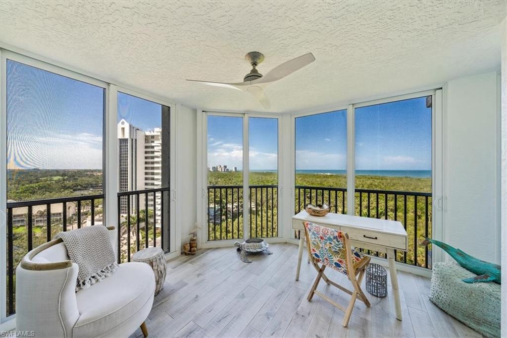 6573 Marissa Loop, Unit 1002 Naples, FL 34108 - Photo 7 of 24 a dining room with furniture window and wooden floor