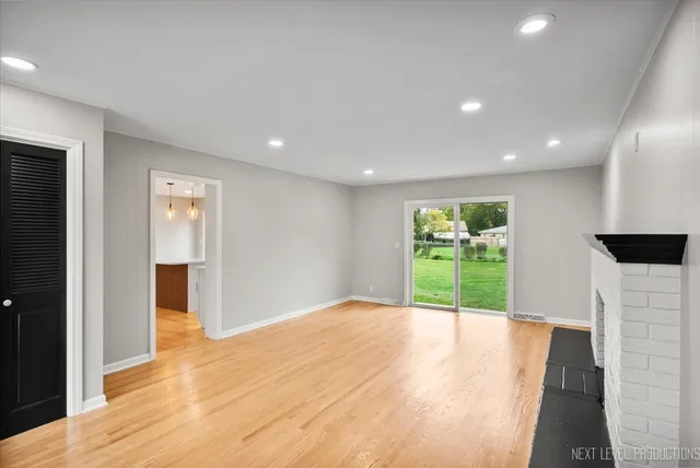 a view of an empty room with a window