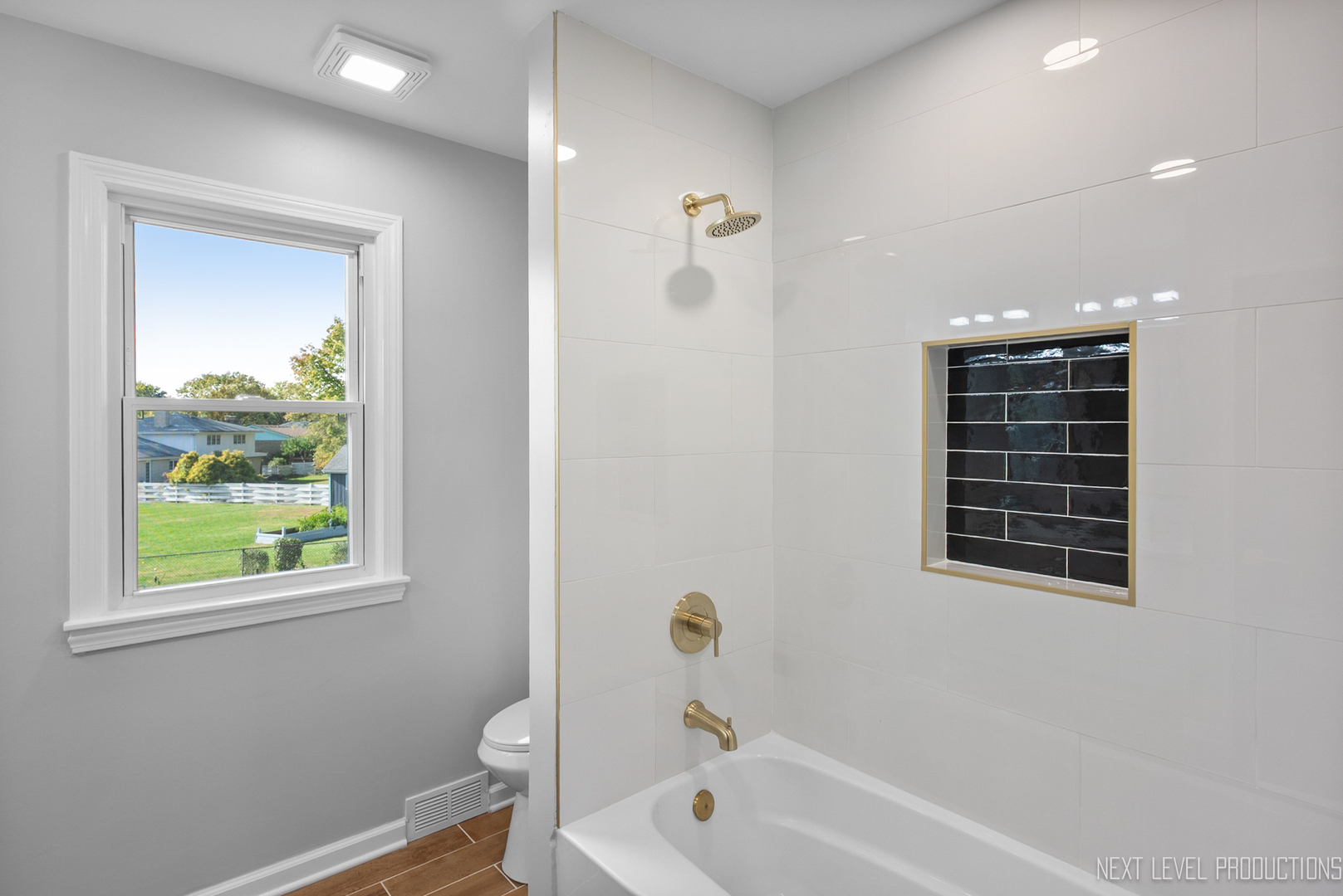 27 South Canterbury Road Aurora, IL 60506 - Photo 19 of 39 a bathroom with a bathtub and a shower