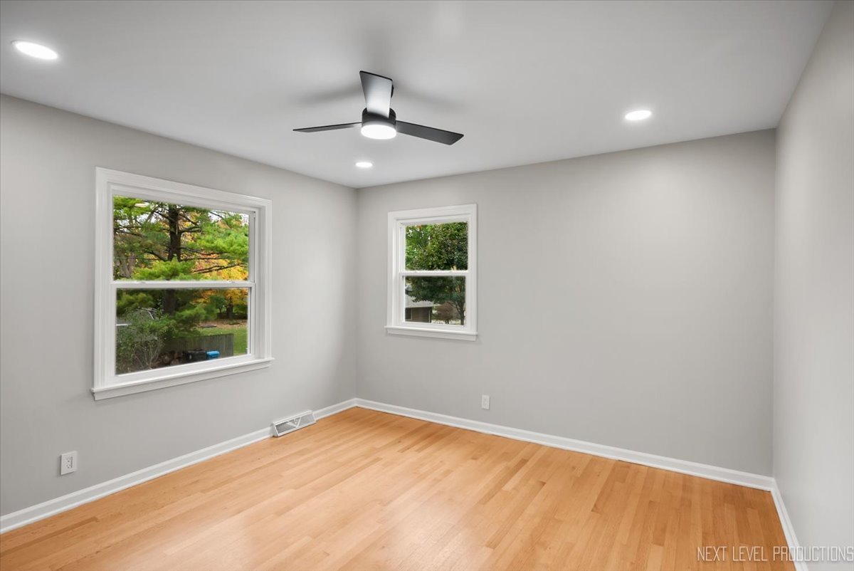 27 South Canterbury Road Aurora, IL 60506 - Photo 20 of 39 a view of an empty room with a window