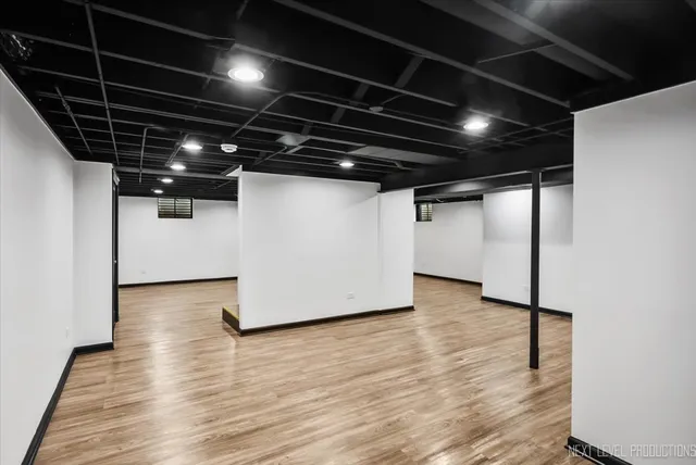 a view of a room with wooden floor