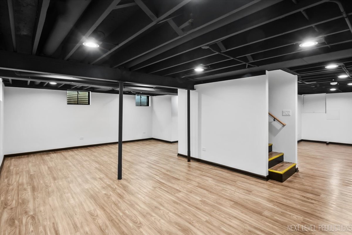 27 South Canterbury Road Aurora, IL 60506 - Photo 25 of 39 a view of a room with wooden floor