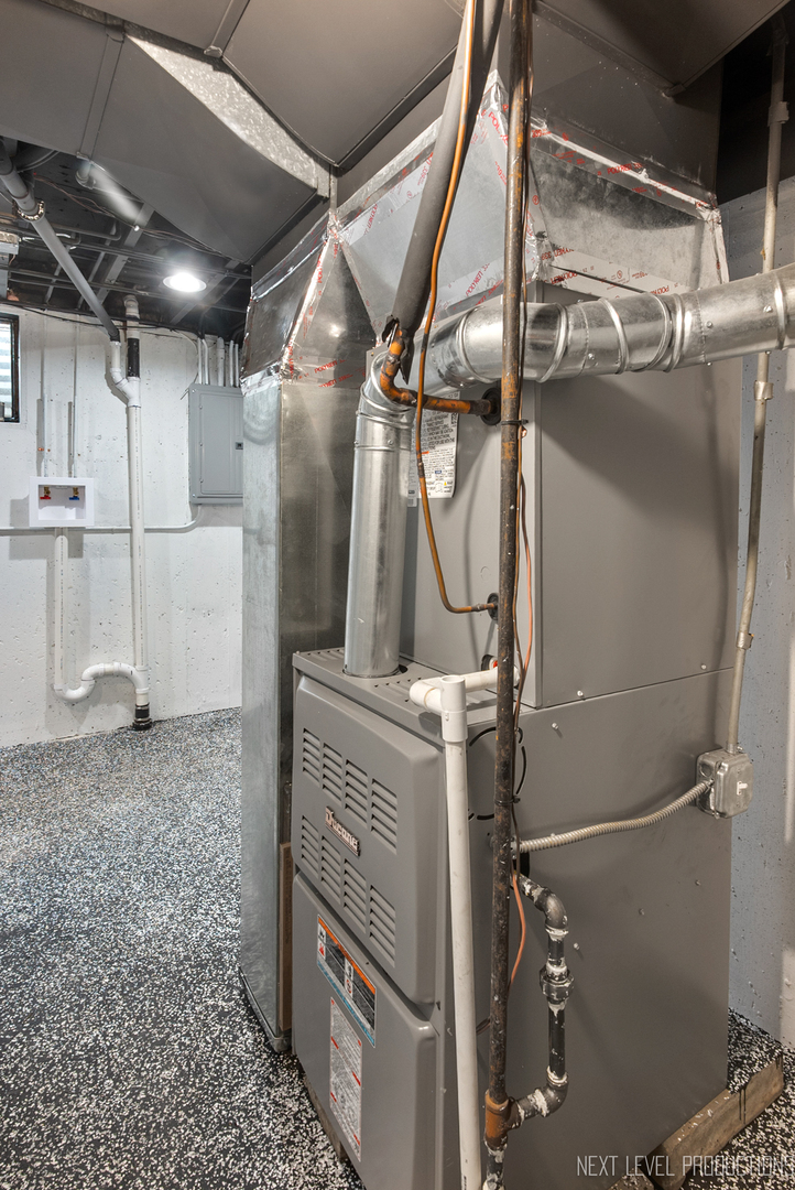 27 South Canterbury Road Aurora, IL 60506 - Photo 26 of 39 a utility room with a lot of cabinets