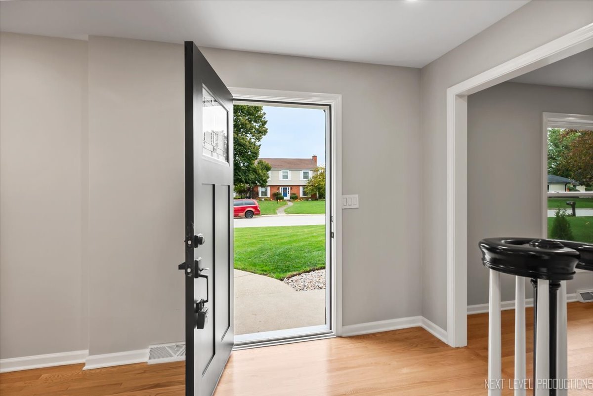 27 South Canterbury Road Aurora, IL 60506 - Photo 3 of 39 a view of a livingroom with a floor to ceiling window