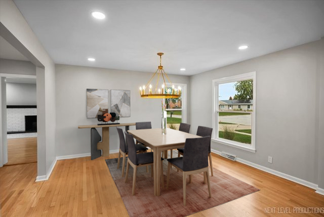 27 South Canterbury Road Aurora, IL 60506 - Photo 8 of 39 a view of a dining room with furniture and wooden floor