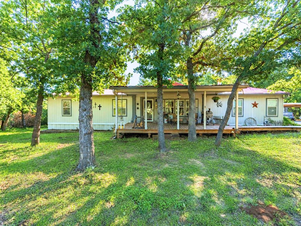 3275 Finis Road Graham, TX 76450 - Photo 1 of 36 a view of a house with backyard porch and sitting area