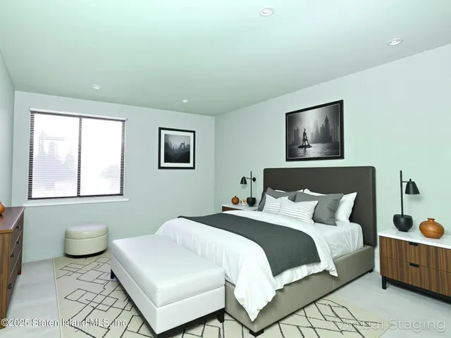 a front view of a house with a yard and potted plants