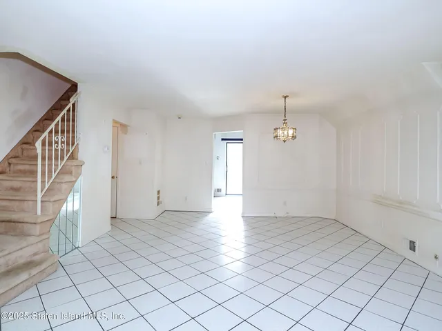 a kitchen with stainless steel appliances a stove a refrigerator sink and cabinets