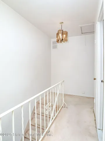 a bathroom with a glass shower door and a toilet