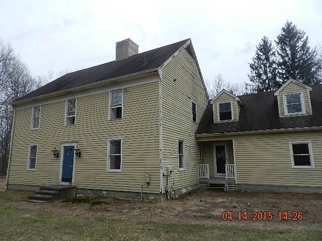 21 Huntingtown Road Newtown, CT 06470 - Photo 1 of 1 a front view of a house with a yard