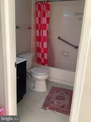 a bedroom with a bed and a table