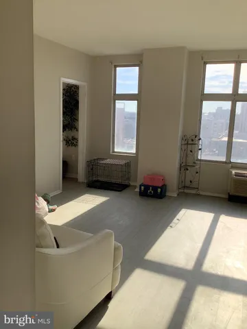 a living room with furniture and windows