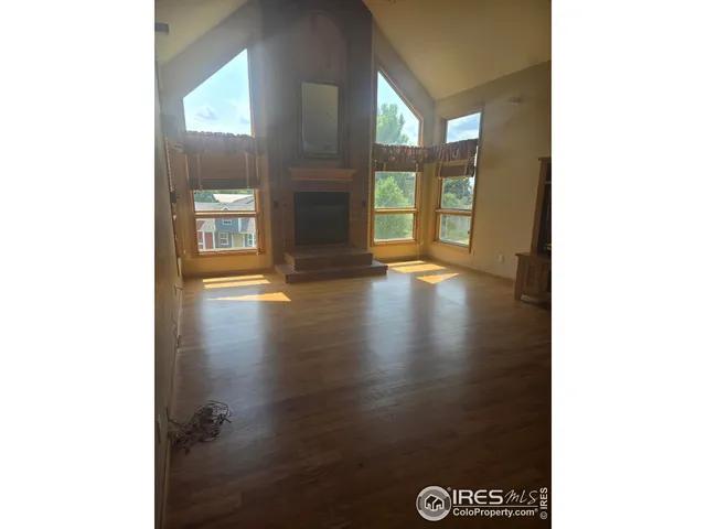 a view of an empty room with glass door