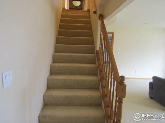a view of staircase with white walls