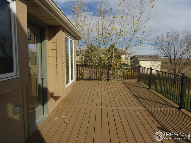 a view of outdoor space with wooden floor