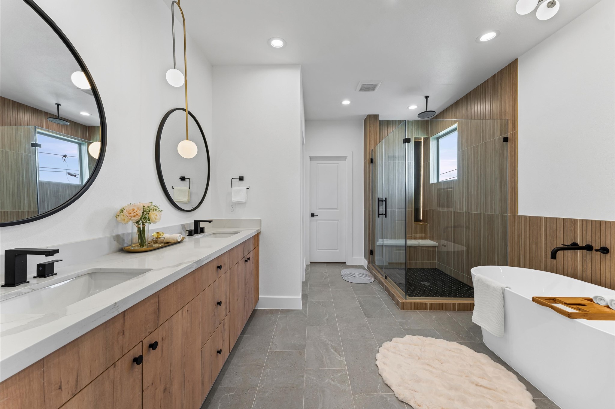 a bathroom with a double vanity sink mirror and toilet