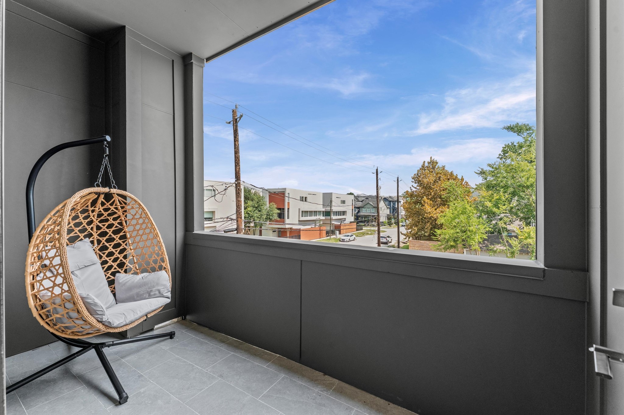 1122 West 17th Street, Unit E Houston, TX 77008 - Photo 20 of 37 a view of a balcony wooden floor and outdoor seating